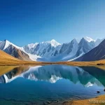 키르기스스탄에서 가볼 만한 산맥 - **"Celestial Mountain Majesty with Alpine Lake"**
    A wide, breathtaking panoramic shot of the Tia...